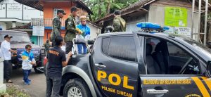Polsek Cineam Kawal Pawai Peraih Medali Emas Peparnas XVI Papua